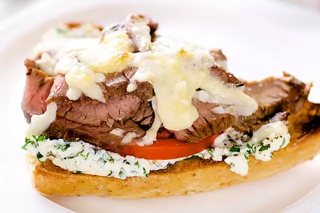 Open-face Flank Steak Sandwiches with Herbed Goat Cheese and Tomatoes